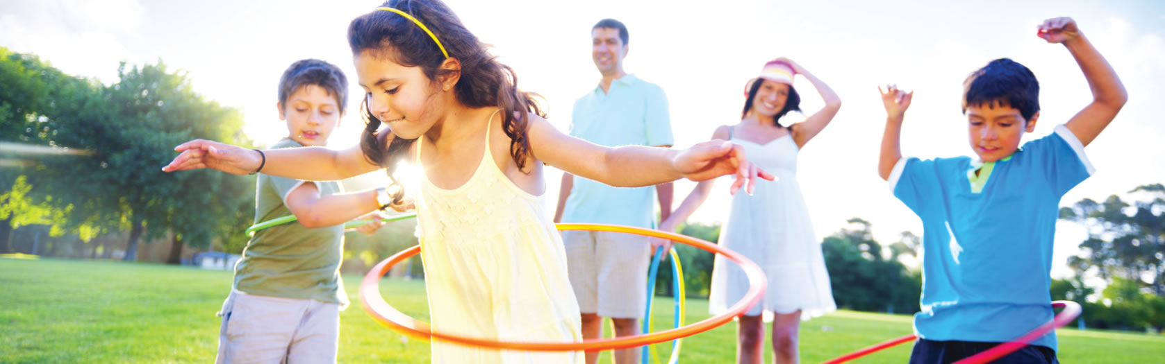 A happy family playing in their yard — still home